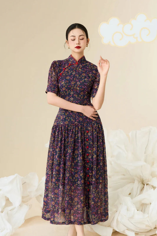 Woman wearing a dark floral modern cheongsam dress with red trim and half sleeves