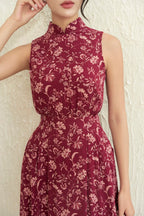 Sleeveless maroon cheongsam dress with light floral pattern and mandarin collar