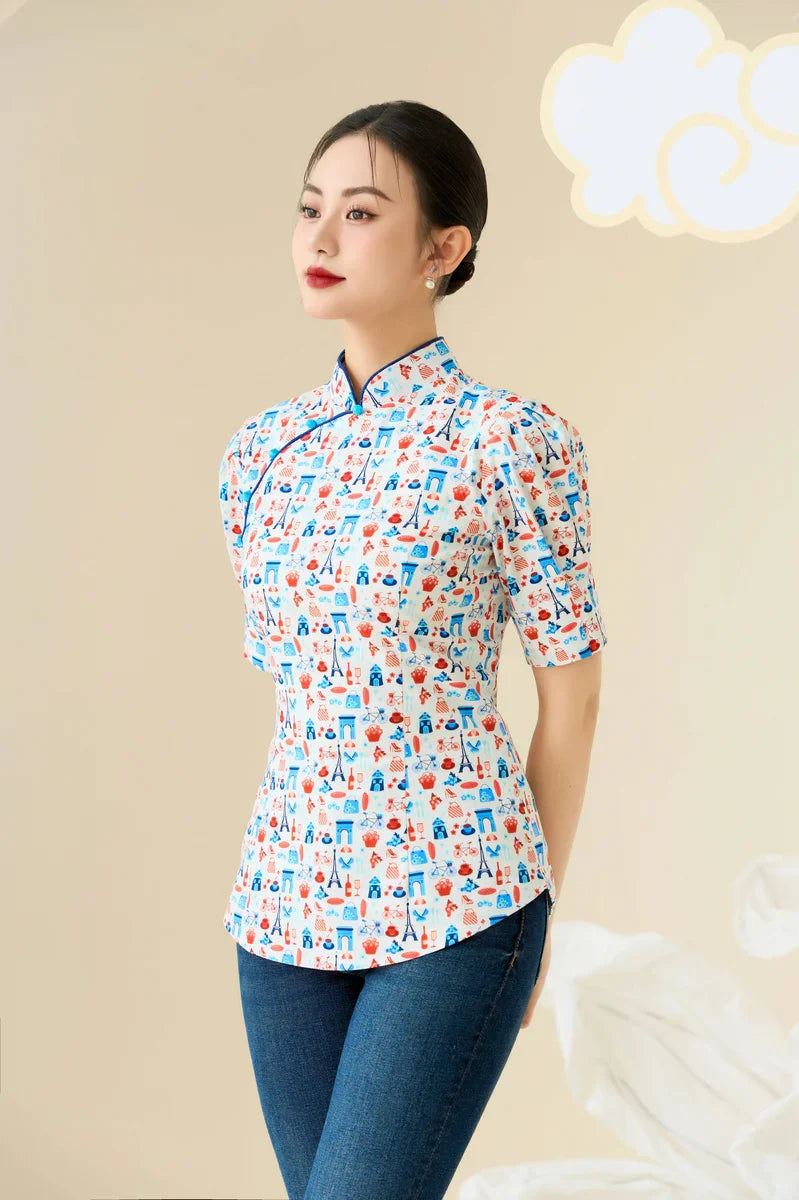 Woman in modern cheongsam top with colorful print, fitted silhouette, and blue jeans