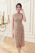 Woman in elegant floral lace cheongsam dress with mandarin collar, standing indoors